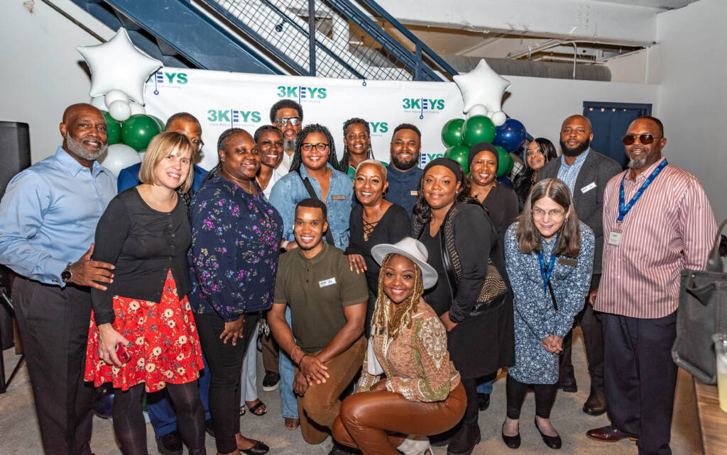 Staff and board members of The 3Keys, join Breakthrough Atlanta supporters gathered for its Cheers for a Cause fundraiser for affordable housing in Atlanta